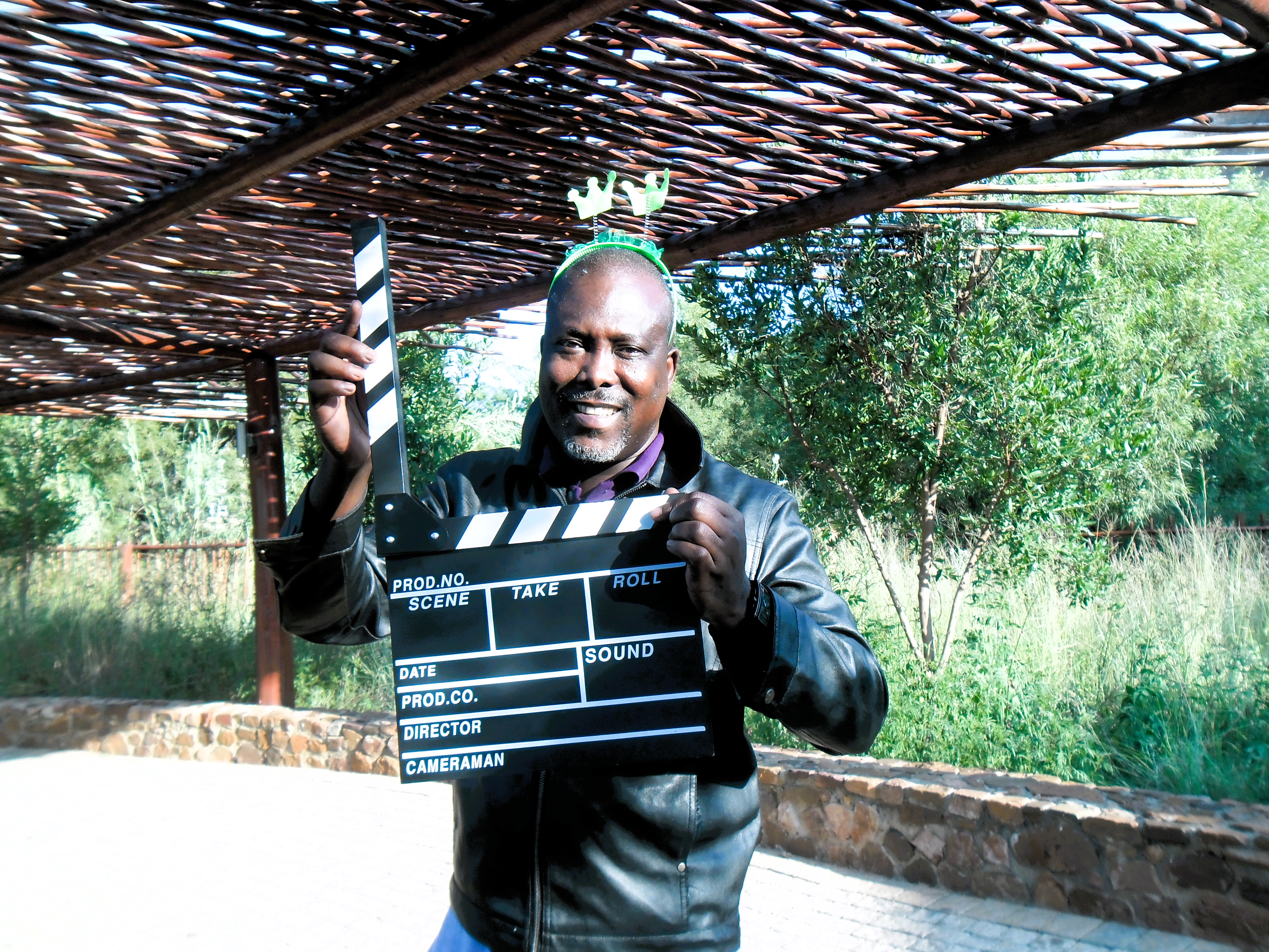 man holding clapper board